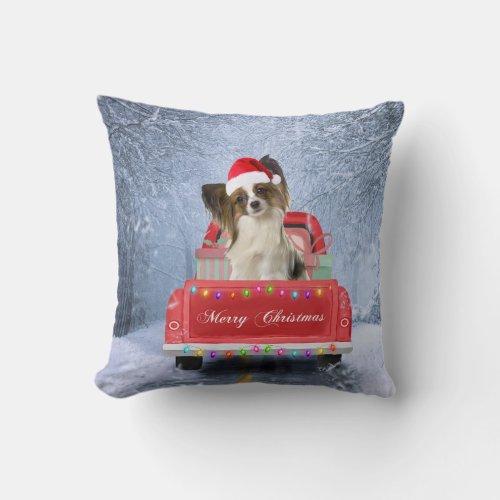 Papillon Dog in Snow sitting in Christmas Truck  Throw Pillow