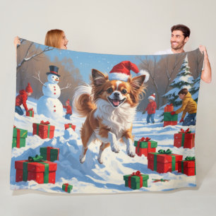 Papillon Dog Running in Snow with Christmas Hat Fleece Blanket