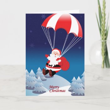 Parachuting Santa Holiday Card by pixelholic at Zazzle