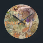 Paris Flapper Art Deco Peacock Vintage Round Clock<br><div class="desc">Vintage Peacock Flapper - This paris flapper collage includes lots of fun vintage images, beautifully arranged for home decor that requires a colorful vintage gift. The image includes a flapper woman looking down at a butterfly, a peacock, and a dragonfly. In the background is the Eiffel tower and other paris...</div>