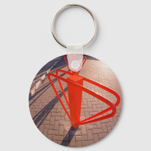 Parking for bicycles in the street closeup keychain