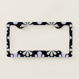 Pastel floral shapes on a black background license plate frame