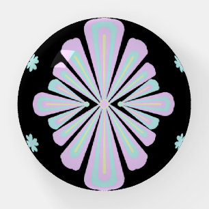 Pastel floral shapes on a black background paperweight