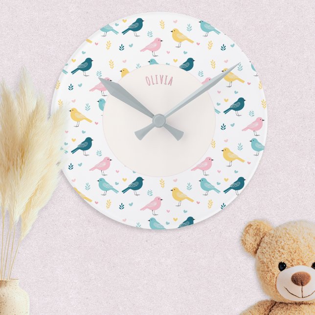 Pastel Scandi Birds Pattern Custom Name Nursery Round Clock (A nursery clock with personalized name and pattern of Scandi style birds in pink, yellow and blue)