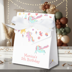 Pastel unicorn magic is all around birthday favor boxes