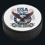 Patriotic American Eagle 250 Years 1776-2026 Hockey Puck<br><div class="desc">Celebrate America's 250th Anniversary with this colorful design featuring a majestic eagle with wings spread in flight carrying the American flag along with the words "USA 250 Years 1776-2026". It's a great way to show your patriotism all throughout the 2026 celebrations and beyond.</div>