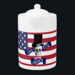 Patriotic American flag Teapot<br><div class="desc">Funny modern proud patriotic American flag design with a fun vintage gothic skull wearing Abraham Lincoln style top hat and a red white and blue stars and stripes american star spangled banner flag , with God bless America text saying. Proudly celebrate thanksgiving or 4th of july independence day in style....</div>