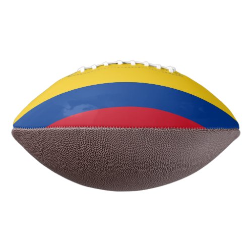 Patriotic american football with flag of Colombia