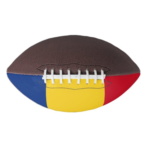 Patriotic american football with flag of Romania