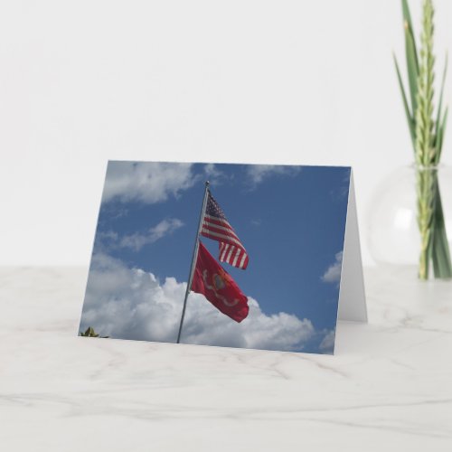 Patriotic flags and a blue sky on a note card