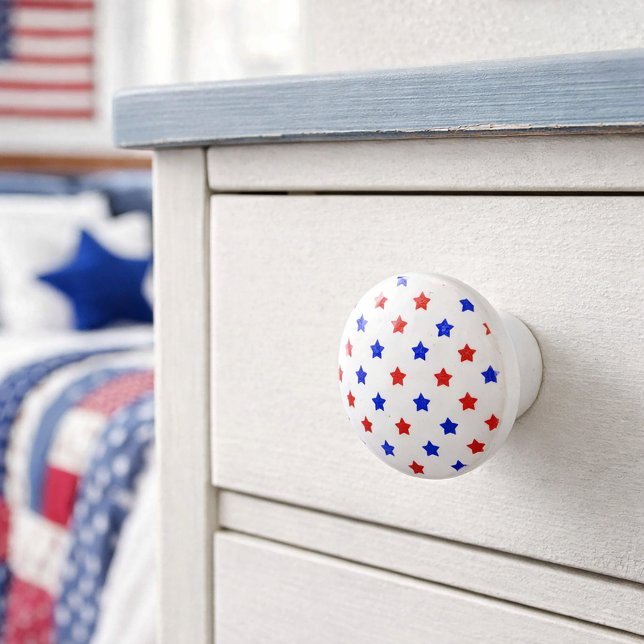 Patriotic Red and Blue Star Pattern Ceramic Knob (A ceramic knob with red and blue star pattern on a white background.)
