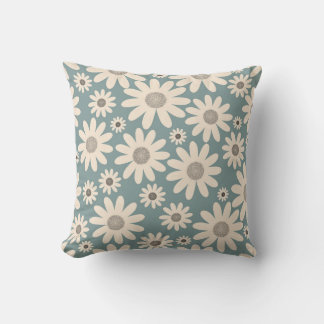 Pattern of chamomile flowers on a soft green throw pillow