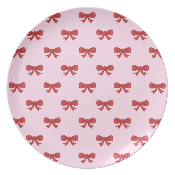 Pattern of nice red bows on pretty pink background plate