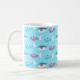 Pattern of purple and blue eyes and fish in sea coffee mug