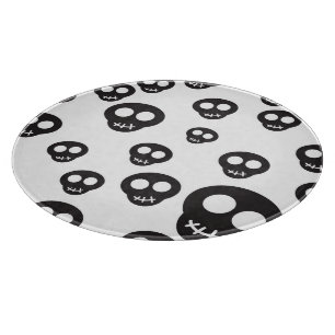 Pattern with black skulls on white cutting board