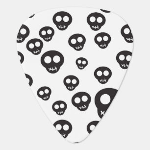 Pattern with black skulls on white guitar pick