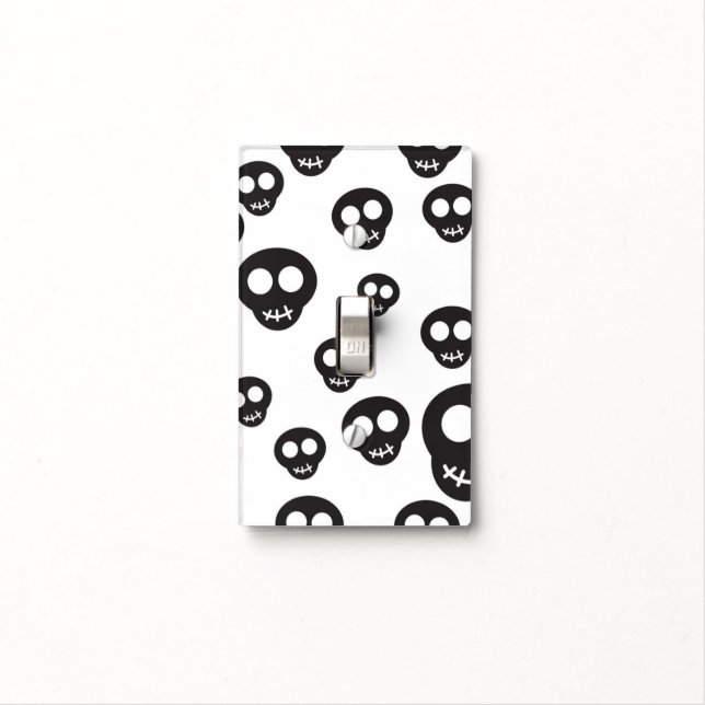 Pattern with black skulls on white light switch cover (In Situ)