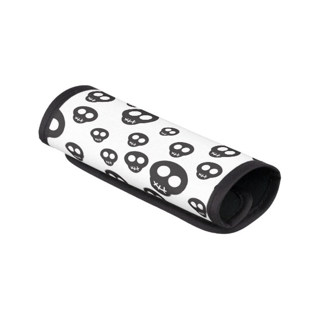 Pattern with black skulls on white luggage handle wrap (Angled)