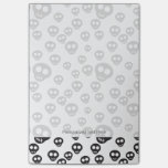 Pattern with black skulls on white post-it notes