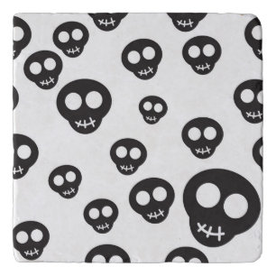 Pattern with black skulls on white trivet
