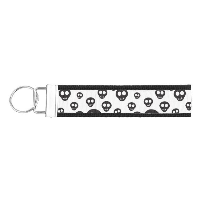Pattern with black skulls on white wrist keychain (Keys on Left)