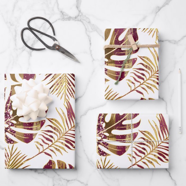 Patterned tropical leaves burgundy and gold wrapping paper sheets (Front)