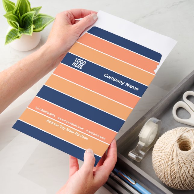 Patttern of blue and peach stripes and logo envelope mailers (Desk)