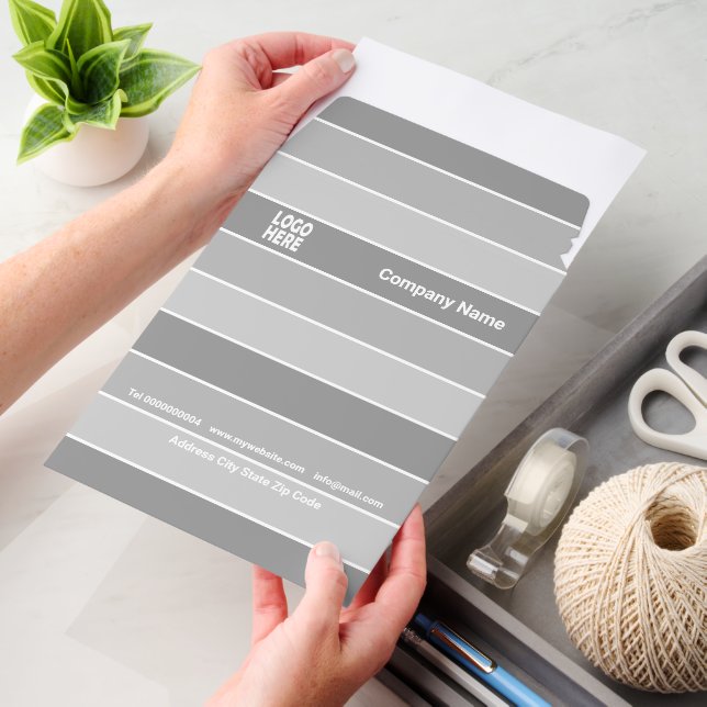 Patttern of three-tone grey stripes and logo envelope mailers (Desk)