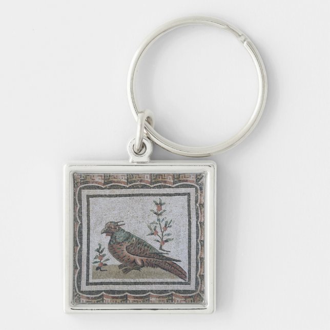Pavement depicting a pheasant keychain (Front)