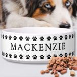 Paw Print Simple Name Pet Bowl<br><div class="desc">This personalized white pet bowl features a charming line of black paw prints along both the top and bottom edges, creating a cute and classic look that pet lovers will adore. Your pet’s name is displayed front and center in a timeless serif font, making it easy to identify while adding...</div>