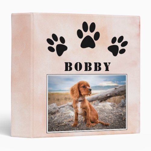 Paw Print Watercolor Dog Pet Photo Album 3 Ring Binder - Paw Print Watercolor Dog Pet Photo Album 3 ring binder. The notebook has black paw prints, a photo and a name on a blush orange watercolor background - personalize the photo and the name with yours.