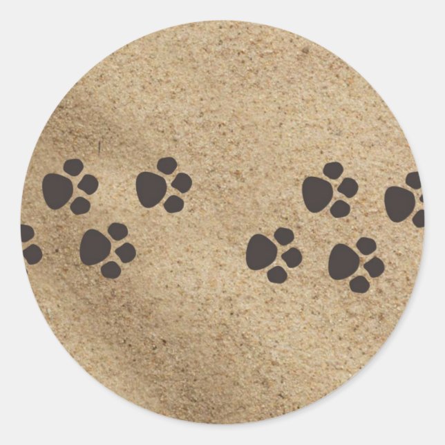 Paw prints in the sand classic round sticker (Front)