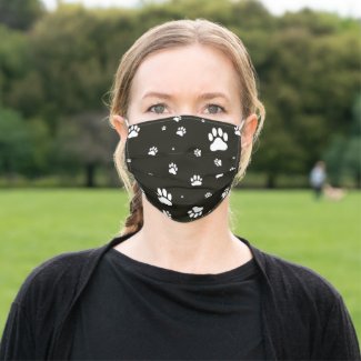 Paw prints on black mask