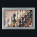 Pawns on Chess Board Belt Buckle<br><div class="desc">Black and white chess pieces</div>