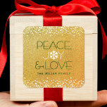 Peace Joy Love Snowflake Typography Gold Holiday Square Sticker<br><div class="desc">“Peace, joy & love.” A fun, playful, white and dark green snowflake illustration and modern typography on a sparkly, faux gold glitter background help you usher in the holiday season. Additional white confetti dots frame the sticker. Feel the warmth and joy of the holidays whenever you use this stunning, graphic,...</div>