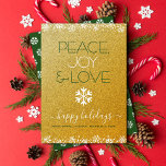 Peace Joy Love Typography Snowflake Gold Glitter Holiday Card<br><div class="desc">“Peace, joy & love.” A fun, playful, white snowflake illustration and modern typography on a sparkly, faux gold glitter background help you usher in the holiday season. White snowflakes and confetti dots frame the card. A white snowflake pattern overlays dark green on the back. Feel the warmth and joy of...</div>
