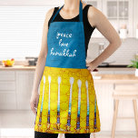 Peace Love Hanukkah Script Yellow Menorah Custom Apron<br><div class="desc">“Peace, love, Hanukkah.” Here’s a wonderful way add to the fun of your holiday baking. Add extra sparkle to your holiday culinary adventures whenever you wear this stunning, colorful, Hanukkah apron. A close-up photo of a bright, colorful, yellow gold artsy menorah photo, along with calligraphy script overlaying a textured turquoise,...</div>