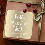 Peace Love Joy Chic Modern Typography Gold Holiday Square Sticker<br><div class="desc">“Peace, love & joy.” A playful visual of white, whimsical, handwritten typography and champagne gold confetti dots against a faux champagne gold foil background, helps you usher in Christmas and New Year. Feel the warmth and joy of the holiday season whenever you use this stylish and modern custom sticker. Matching...</div>