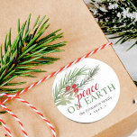 Peace on Earth Festive Christmas Greenery Classic Round Sticker<br><div class="desc">Festive watercolor greenery with red berries Christmas sticker.</div>