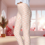 Peach Checkerboard Heart Valentine's Day Leggings<br><div class="desc">These Peach Checkerboard Heart Valentine's Day Leggings are perfect for celebrating the season of love. Featuring a charming peach and white checkerboard heart pattern, these leggings add a cute and romantic vibe to your Valentine's Day outfit. Made with comfortable, soft material, these leggings are a stylish choice for lounging or...</div>