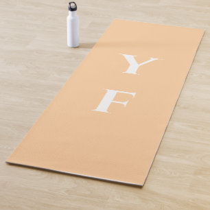 Peach color yoga mat with custom name initials