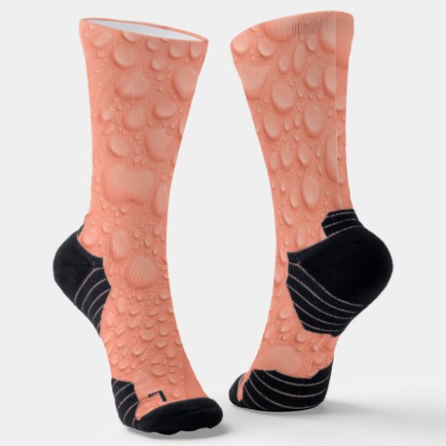 Peach colored background with water drops socks