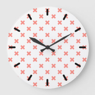 Peach cross stitches on white large clock