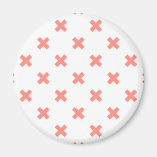 Peach cross stitches on white magnet