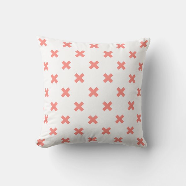 Peach cross stitches on white throw pillow (Front)