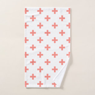 Peach polka crosses on white hand towel 