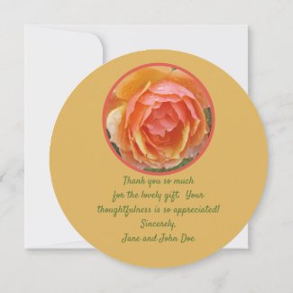 PEACH, YELLOW AND SALMON COLORED ROSE WITH RAINDRO