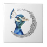 Peacock Silver Glitter Moon Tile<br><div class="desc">This is a watercolor painting of a peacock. The bird has beautiful blending colors of blue and green. The bird is looking very noble and proud. There is faux silver glitter circle around the bird.</div>