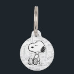 PEANUTS | Snoopy on Black White Comics Pet ID Tag<br><div class="desc">This Peanuts artwork features Snoopy sitting on background of black and white Charles M. Schulz comic strips.</div>