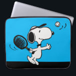 Peanuts | Snoopy Plays Tennis Laptop Sleeve<br><div class="desc">In the Peanuts comic strip and animated films,  Snoopy is often depicted playing tennis against his owner Charlie Brown or other characters like Linus and Lucy. This design showcases Snoopy's athletic abilities and competitive spirit in a humorous way.</div>